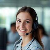 Helpful customer support representative with headset.
